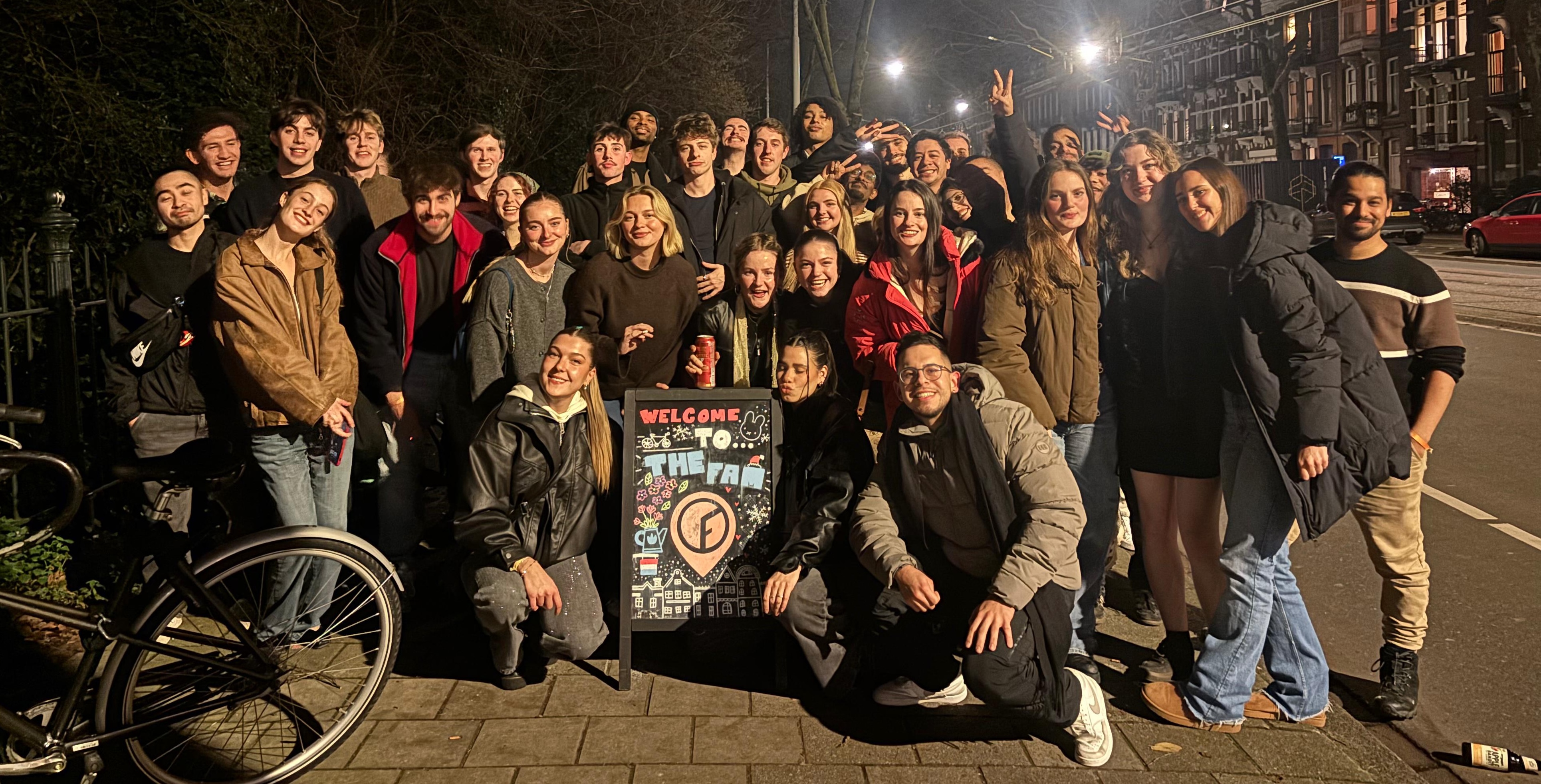 Group photo from a hostel meetup in Amsterdam